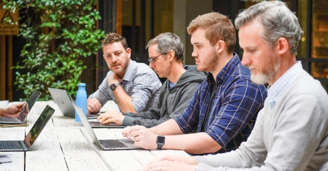 A team retrospective in the courtyard